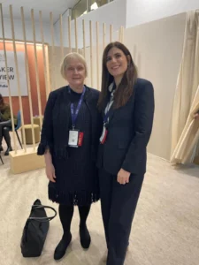 Dr. Roxanna Sadoughifar meeting with an international medical expert at a global dermatology and aesthetic medicine conference.